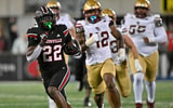 Oct 25, 2025; Louisville, Kentucky, USA; Louisville Cardinals running back Keyjuan Brown (22) runs the ball for a touchdown against the Boston College Eagles during the second half at L&N Federal Credit Union Stadium. Mandatory Credit: Jamie Rhodes-Imagn Images