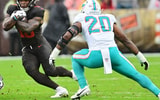 Oct 19, 2025; Cleveland, Ohio, USA; Cleveland Browns running back Quinshon Judkins (10) runs with the ball against Miami Dolphins linebacker Jordyn Brooks (20) during the first quarter at Huntington Bank Field.