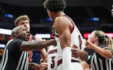 A referee has to separate Bucknell Bison forward Amon Dörries (22) and Louisville Cardinals forward Khani Rooths (9) during an exhibition game at the KFC Yum! Center in Louisville, Kentucky Tuesday October 28, 2028.