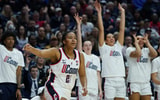 UConn's bench celebrates a three-pointer