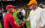 Brianna Paciorka/News Sentinel / USA TODAY NETWORK via Imagn Images | Oklahoma coach Brent Venables and Tennessee coach Josh Heupel shake hands after Oklahoma defeated Tennessee 33-27 in Neyland Stadium in Knoxville on Nov. 1, 2025.