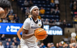 West Virginia guard Amir Jenkins shoots a free throw against Wheeling