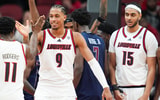 Louisville Cardinals forward Khani Rooths (9) smiles as he draws the foul as Louisville Cardinals guard Kobe Rodgers (11) celebrates as the Cards are rolling past South Carolina State 71-17 in the second half at the KFC Yum! Center Monday night, Nov. 3, 2025.