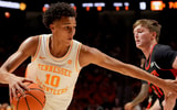 Saul Young/News Sentinel / USA TODAY NETWORK via Imagn Images | Tennessee forward Nate Ament (10) tries to the basket while guarded by Mercer guard Brady Shoulders (11) in an NCAA college basketball game on November 3, 2025, in Knoxville, Tenn.