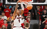 Nov 3, 2025; Louisville, Kentucky, USA; Louisville Cardinals forward Khani Rooths (9) dunks against the South Carolina State Bulldogs during the first half at KFC Yum! Center. Mandatory Credit: Jamie Rhodes-Imagn Images