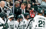 Michigan State's head coach Adam Nightingale, center, talks with the team during a break in the action in the first period of the game against New Hampshire on Thursday, Oct. 9, 2025. - Nick King, USA TODAY Sports