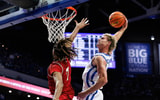 Nov 4, 2025; Lexington, Kentucky, USA; Kentucky Wildcats guard Collin Chandler (5) dunks the ball over Nicholls Colonels forward Grant Sanders (7) during the second half at Rupp Arena at Central Bank Center. Mandatory Credit: Jordan Prather-Imagn Images