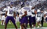 Northwestern Wildcats wide receiver Ricky Ahumaraeze (10) and offensive lineman Martes Lewis (75) celebrate with running back Caleb Komolafe (5) after scoring a touchdown during the fourth quarter against the Penn State Nittany Lions at Beaver Stadium