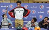 Stepinac High School basketball star Jasiah Jervis unveils a Michigan State University t-shirt as he announces which college he will be attending and playing basketball. - Seth Harrison, USA TODAY Sports