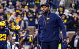 Michigan Wolverines football head coach Sherrone Moore during warmups ahead of the 2025 Purdue win. (Photo by Junfu Han / USA TODAY NETWORK via Imagn Images)