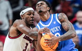 Louisville Cardinals guard Ryan Conwell (3) tussles with Kentucky Wildcats guard Otega Oweh (00) for control in the first half suring the UofL-UK annual rivalry game at the KFC Yum! Center in Louisville, Kentucky Nov. 11, 2025.