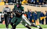 Michigan State's Elijah Tau-Tolliver runs for a gain against Michigan during the fourth quarter on Saturday, Oct. 25, 2025, at Spartan Stadium in East Lansing. - Nick King, USA TODAY Sports