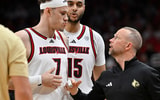 Nov 15, 2025; Louisville, Kentucky, USA; Louisville Cardinals head coach Pat Kelsey talks with forward Kasean Pryor (7) during the first half against the Ohio Bobcats at KFC Yum! Center. Mandatory Credit: Jamie Rhodes-Imagn Images