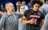 Feb 16, 2025; South Bend, Indiana, USA; Louisville Cardinals head coach Pat Kelsey talks to guard Chucky Hepburn (24) after he left the game against the Notre Dame Fighting Irish at the Purcell Pavilion. Louisville won 75-60. Mandatory Credit: Matt Cashore-Imagn Images