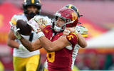 USC Trojans wide receiver Makai Lemon (6) catches a pass against the defense of Iowa Hawkeyes defensive back Zach Lutmer (6) during the second half at the Los Angeles Memorial Coliseum