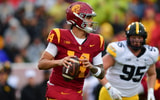 USC Trojans quarterback Jayden Maiava (14) moves out to pass against the Iowa Hawkeyes during the first half at the Los Angeles Memorial Coliseum