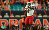 Oct 17, 2025; Miami Gardens, Florida, USA; Louisville Cardinals wide receiver Chris Bell (0) reacts after a carry against the Miami Hurricanes during the second quarter at Hard Rock Stadium. Mandatory Credit: Sam Navarro-Imagn Images