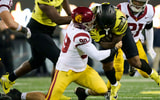 USC Trojans defensive lineman Jack Sullivan (99) tackles Oregon Ducks running back Jordan James (20) during the second half at Autzen Stadium