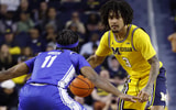 Nov 19, 2025; Ann Arbor, Michigan, USA; Michigan Wolverines guard Elliot Cadeau (3) dribbles defended by Middle Tennessee Blue Raiders guard Tre Green (11) in the first half at Crisler Center. Mandatory Credit: Rick Osentoski-Imagn Images
