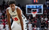 Nov 11, 2025; Cincinnati, Ohio, USA; Cincinnati Bearcats forward Baba Miller (18) stands on the court against the Dayton Flyers in the second half at Fifth Third Arena. Mandatory Credit: Aaron Doster-Imagn Images