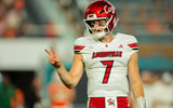 Oct 17, 2025; Miami Gardens, Florida, USA; Louisville Cardinals quarterback Miller Moss (7) reacts on the field against the Miami Hurricanes during the second quarter at Hard Rock Stadium. Mandatory Credit: Sam Navarro-Imagn Images