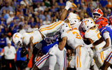 Nov 22, 2025; Gainesville, Florida, USA; Tennessee Volunteers running back Desean Bishop (18) leaps over the defense for a touchdown against the Florida Gators during the first half at Ben Hill Griffin Stadium. Mandatory Credit: Matt Pendleton-Imagn Images