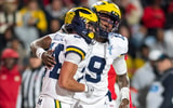 Nov 22, 2025; College Park, Maryland, USA; Michigan Wolverines quarterback Bryce Underwood (19) celebrates with running back Bryson Kuzdzal (24) after scoring a touchdown during the second half against the Maryland Terrapins at SECU Stadium. Mandatory Credit: Tommy Gilligan-Imagn Images