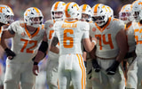 Tennessee quarterback Joey Aguilar (6) huddles with the offensive line during an NCAA college football game against Florida on November 22, 2025, in Gainesville, Florida.