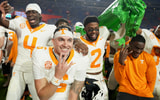 Tennessee quarterback Joey Aguilar (6), along with and defensive backs Ty Redmond (4) and Andre Turrentine (2), celebrate the win over Florida in an NCAA college football game on November 22, 2025, in Gainesville, Florida.