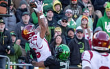 USC wide receiver Tanook Hines hauls in a touchdown pass under cover from Oregon defensive back Aaron Flowers as the Oregon Ducks host the USC Trojans on Nov. 22, 2025, at Autzen Stadium in Eugene, Oregon