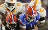 Florida wide receiver TJ Abrams (4) and Florida quarterback DJ Lagway (2) gets snatched off their feet by Tennessee defensive lineman Joshua Josephs (19) and Tennessee defensive lineman Tyre West (42) during the second half of an NCAA football game against Tennessee at Steve Spurrier Field at Ben Hill Griffin Stadium in Gainesville, FL on Saturday, November 22, 2025. Florida lost to Tennessee 31-11[Alan Youngblood/Gainesville Sun]