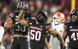 Louisville Cardinals defensive lineman Clev Lubin (50) celebrates his tackle of Clemson Tigers quarterback Cade Klubnik (2) in the first half at L&N Stadium Friday, Nov. 14, 2025. (© Matt Stone/Courier Journal / USA TODAY NETWORK via Imagn Images)