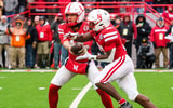 Nebraska football QB TJ Lateef (left) and RB Emmett Johnson against Iowa