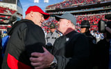 Louisville head coach Jeff Brohm congratulates Kentucky head coach Mark Stoops after the Wildcats beat Louisville 38-31 Saturday and retaining the Governor's Cup. It was Brohm's first Governor's Cup game as head coach for UofL. Nov. 24, 2023. © Matt Stone/The Courier Journal / USA TODAY NETWORK