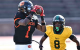 Withrow wide receiver Charles Alexander Jr. (1) catches a pass in front of Taft defensive back Kavontae Whipple (8) during a football game on Saturday, Sept. 27, 2025.