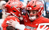 Louisville Cardinals tight end Jaleel Skinner (88) hugs Louisville Cardinals quarterback Miller Moss (7) after scoring a touchdown pass in the second half as the Cards dominated Kentucky 41-0 Saturday, November 29, 2025 in Louisville, Kentucky at L&N Federal Credit Union Stadium.