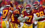 USC Trojans cornerback Alex Graham (27) safety Christian Pierce (24) cornerback Decarlos Nicholson (17) and safety Kennedy Urlacher (28) celebrate after Iowa Hawkeyes turn the ball over on fourth down during the second half at the Los Angeles Memorial Coliseum