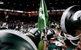 Michigan State players sing the Michigan State fight song after defeating Maryland at Ford Field. - Brendan Mullin, USA TODAY Sports