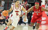 Dec 3, 2025; Fayetteville, Arkansas, USA; Arkansas Razorbacks guard Darius Acuff Jr (5) drives against Louisville Cardinals guard Ryan Conwell (3) during the first half at Bud Walton Arena. Mandatory Credit: Nelson Chenault-Imagn Images