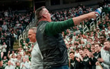 Michigan State's new football coach Pat Fitzgerald hypes up the Izzone before the Spartans basketball game against Iowa on Tuesday, Dec. 2, 2025, at the Breslin Center in East Lansing. - Nick King, USA TODAY Sports