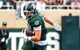 Michigan State's Jack Velling, left, catches a pass as Youngstown State's Isaiah Hackett defends during the third quarter on Saturday, Sept. 13, 2025, at Spartan Stadium in East Lansing. - Nick King, USA TODAY Sports