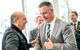 Greg Williams, left, shakes hands with Michigan State's new football coach Pat Fitzgerald during the coach's introductory press conference on Tuesday, Dec. 2, 2025, at the Tom Izzo Football Building. - Nick King, USA TODAY Sports