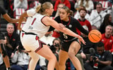 Dec 4, 2025; Louisville, Kentucky, USA; South Carolina Gamecocks guard Tessa Johnson (5) dribbles under the pressure of Louisville Cardinals forward Laura Ziegler (0) during the first half at KFC Yum! Center. Mandatory Credit: Jamie Rhodes-Imagn Images