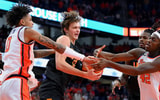 Dec 2, 2025; Syracuse, New York, USA; Tennessee Volunteers forward Cade Phillips (center) battles with Syracuse Orange forwards Sadiq White Jr. (left) and William Kyle III (right) during the first half at the JMA Wireless Dome. Mandatory Credit: Rich Barnes-Imagn Images