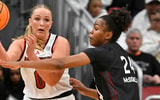 Dec 4, 2025; Louisville, Kentucky, USA; Louisville Cardinals forward Laura Ziegler (0) looks to pass under the pressure of South Carolina Gamecocks guard Ayla McDowell (24) during the second half at KFC Yum! Center. South Carolina defeated Louisville 79-77. Mandatory Credit: Jamie Rhodes-Imagn Images