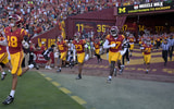 USC Trojans run out of the tunnel and on to the field for the game against the Michigan Wolverines at United Airlines Field at the Los Angeles Memorial Coliseum
