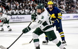 Michigan State's Daniel Russell shoots the puck against Michigan during the third period on Friday, Dec. 5, 2025, at Munn Ice Arena in East Lansing. - Nick King, USA TODAY Sports