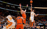 Dec 6, 2025; Nashville, Tennessee, USA;  Tennessee Volunteers guard Ja'Kobi Gillespie (0) shoots over  Illinois Fighting Illini forward Ben Humrichous (3) during the first half at Bridgestone Arena. Mandatory Credit: Steve Roberts-Imagn Images