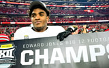 Texas Tech EDGE Romello Height holding a "Big 12 Champs" sign