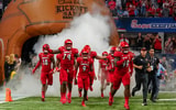 Sep 6, 2021; Atlanta, Georgia, USA; The Louisville Cardinals run out of the tunnel on to the field to take on the Mississippi Rebels at Mercedes-Benz Stadium. Mandatory Credit: Dale Zanine-Imagn Images